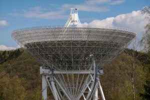 view of communications tower against cloudy sky